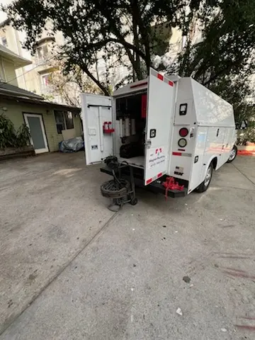 Magnet Plumbing service vehicle on-site for Grease Trap Cleaning in Omak